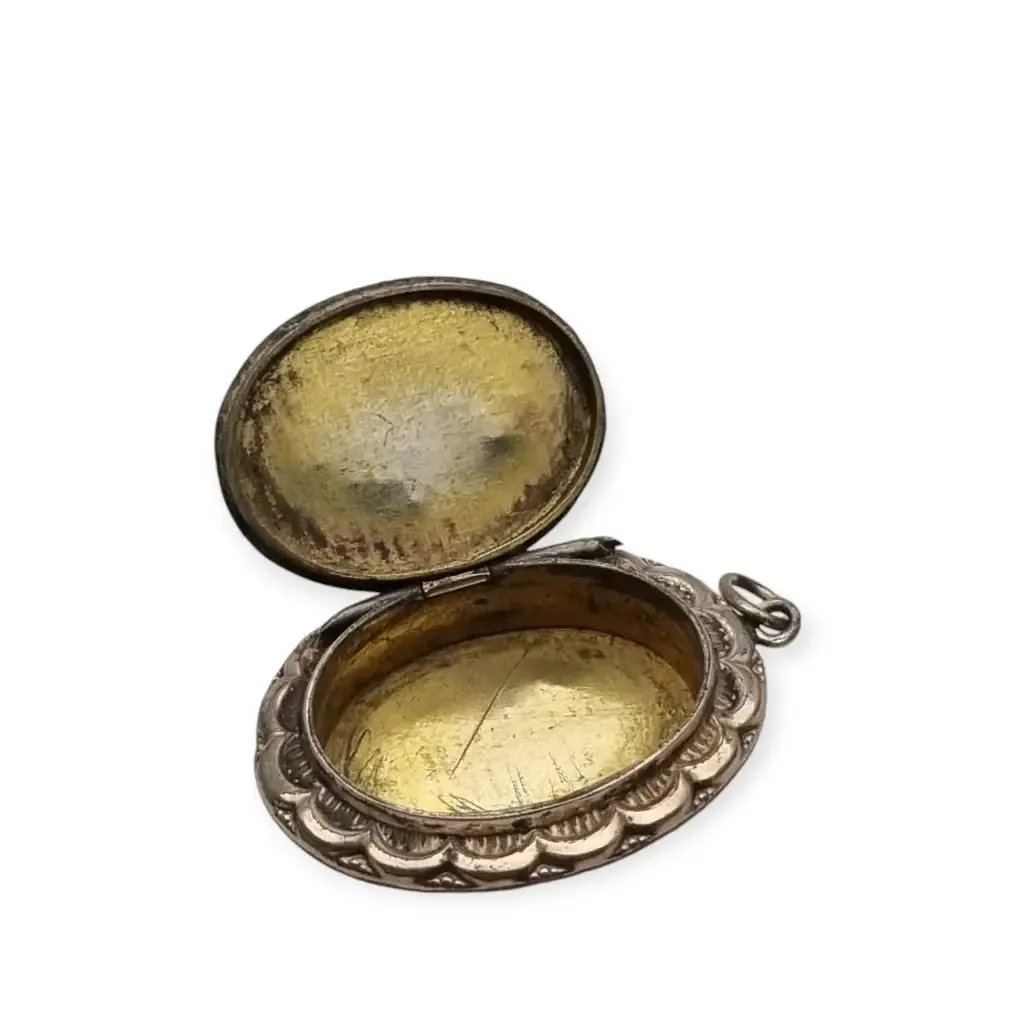 Victorian locket, antique highly decorated gilt silver pendant, Circa 1900.