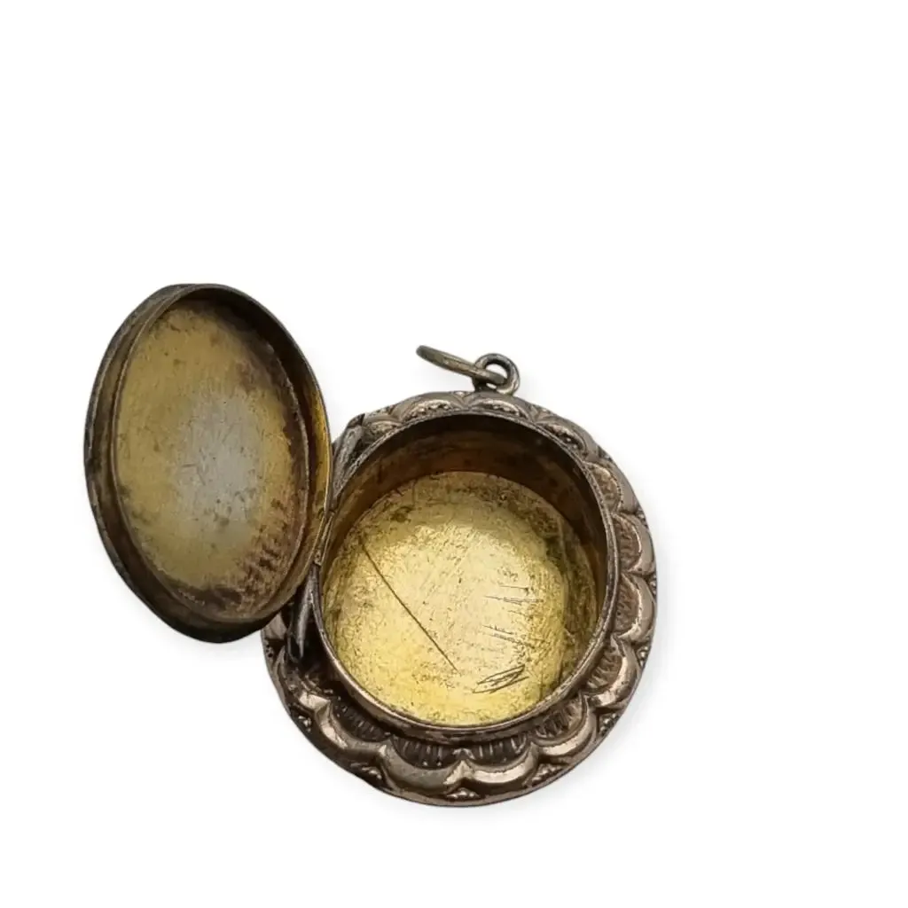 Victorian locket, antique highly decorated gilt silver pendant, Circa 1900.