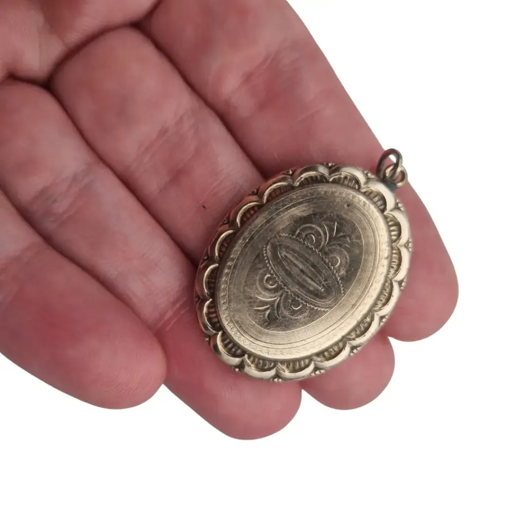 Victorian locket, antique highly decorated gilt silver pendant, Circa 1900.